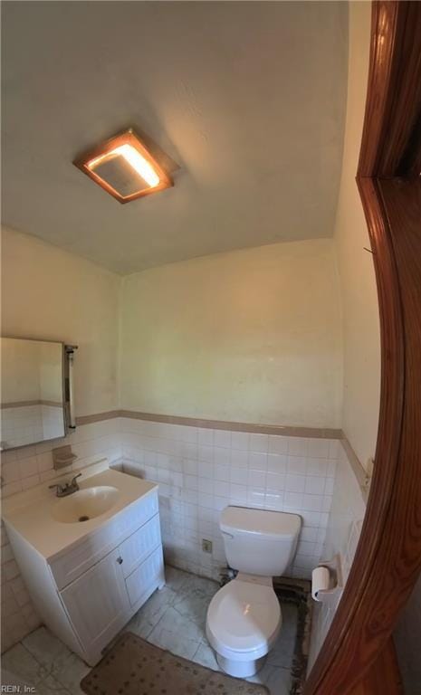 3244 Pruden Blvd, Suffolk, VA 23434 - half bathroom with tile walls, vanity, wainscoting, and tile patterned flooring
