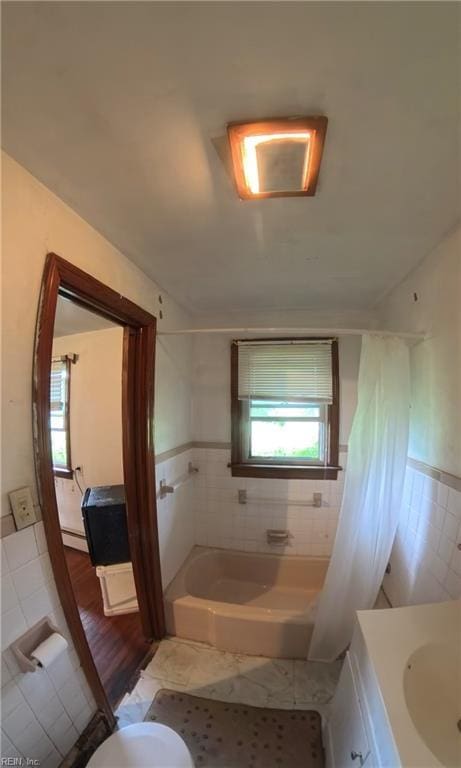 3244 Pruden Blvd, Suffolk, VA 23434 - bathroom featuring a bathtub, vanity, tile patterned flooring, and tile walls