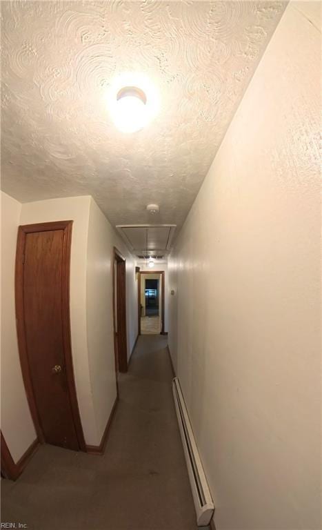 3244 Pruden Blvd, Suffolk, VA 23434 - hallway featuring baseboard heating, attic access, and a textured ceiling
