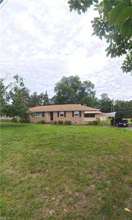 3244 Pruden Blvd, Suffolk, VA 23434 - view of front of property featuring a carport, a front lawn, and brick siding