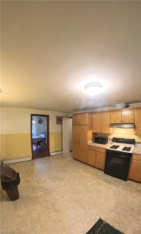 3244 Pruden Blvd, Suffolk, VA 23434 - kitchen with stove, a baseboard radiator, light countertops, and under cabinet range hood
