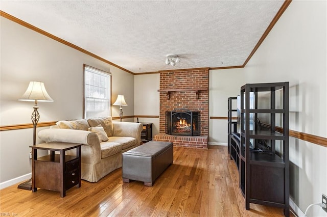102 Canvasback Trl, Newport News, VA 23602 - living area with wood-type flooring, a textured ceiling, crown molding, and a fireplace