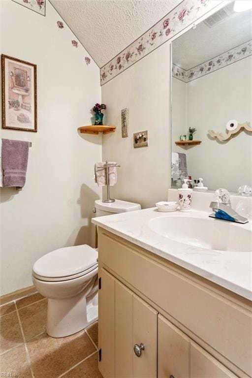 102 Canvasback Trl, Newport News, VA 23602 - half bath with a textured ceiling, vanity, lofted ceiling, and tile patterned flooring