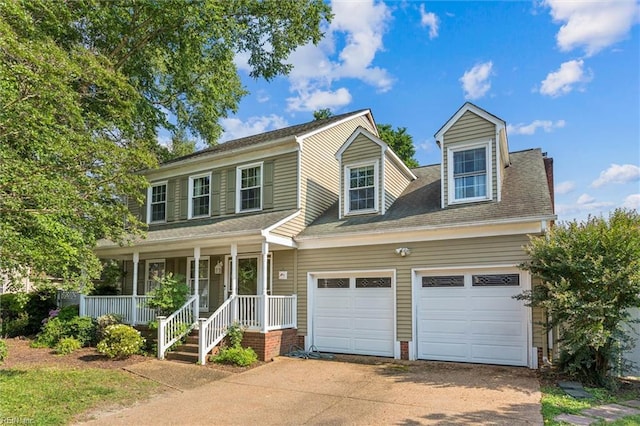 102 Canvasback Trl, Newport News, VA 23602 - view of front of house with covered porch, driveway, an attached garage, and a shingled roof