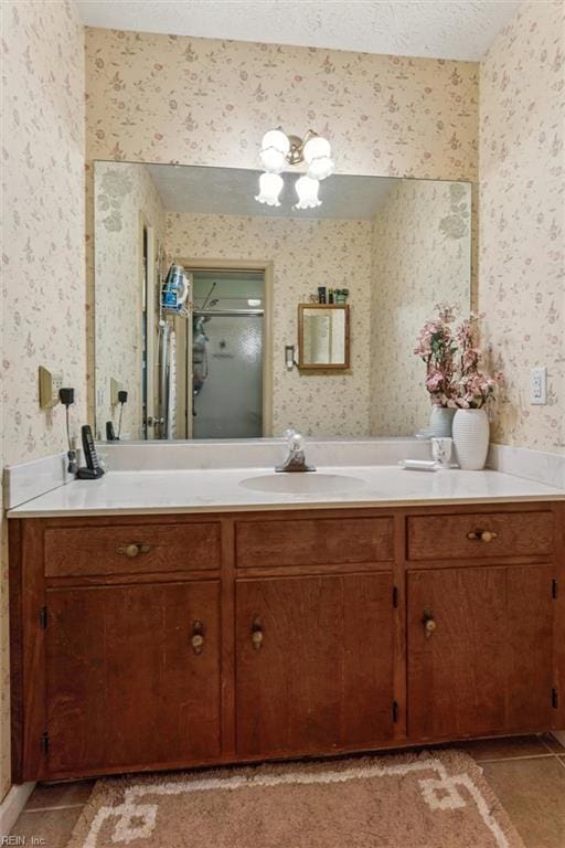 102 Canvasback Trl, Newport News, VA 23602 - bathroom with wallpapered walls, vanity, tile patterned flooring, and a shower with door