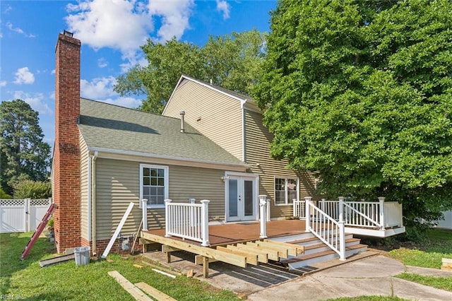 102 Canvasback Trl, Newport News, VA 23602 - rear view of house featuring french doors, a wooden deck, a chimney, roof with shingles, and a gate
