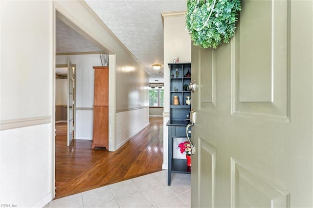 102 Canvasback Trl, Newport News, VA 23602 - hall featuring wood finished floors, crown molding, and a textured ceiling