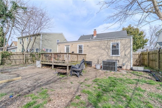 325 E Lorengo Ave, Norfolk, VA 23503 - back of property featuring a deck, a fenced backyard, and a chimney