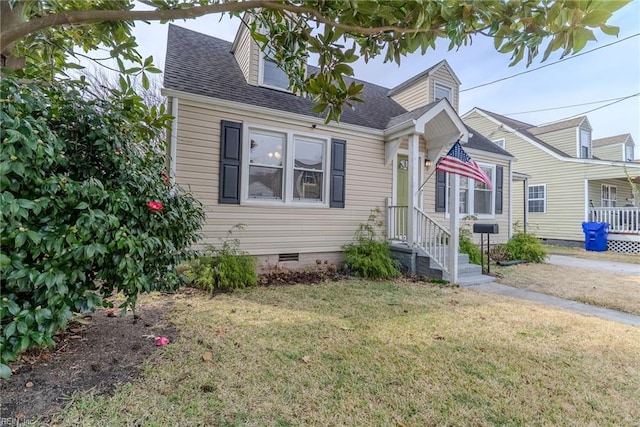 325 E Lorengo Ave, Norfolk, VA 23503 - cape cod-style house with crawl space, a front lawn, and a shingled roof