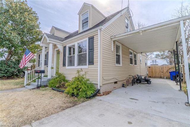325 E Lorengo Ave, Norfolk, VA 23503 - view of side of home featuring an attached carport, crawl space, and a shingled roof