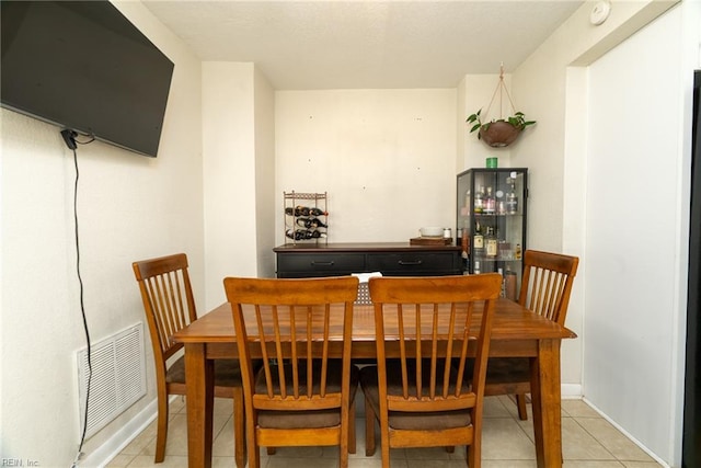 325 E Lorengo Ave, Norfolk, VA 23503 - dining area with light tile patterned flooring and baseboards