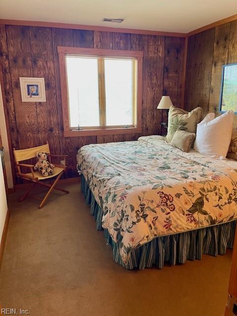 3225 Sandfiddler Rd, Virginia Beach, VA 23456 - carpeted bedroom with wood walls