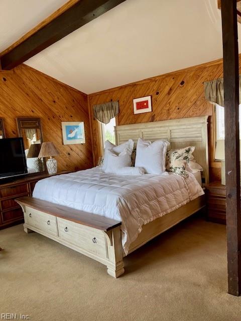 3225 Sandfiddler Rd, Virginia Beach, VA 23456 - bedroom with beam ceiling, wood walls, and carpet