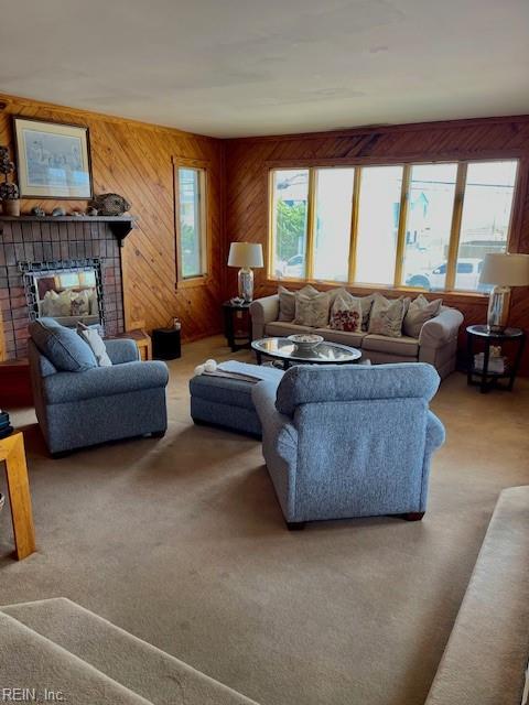 3225 Sandfiddler Rd, Virginia Beach, VA 23456 - living room featuring carpet floors, a tile fireplace, and wooden walls