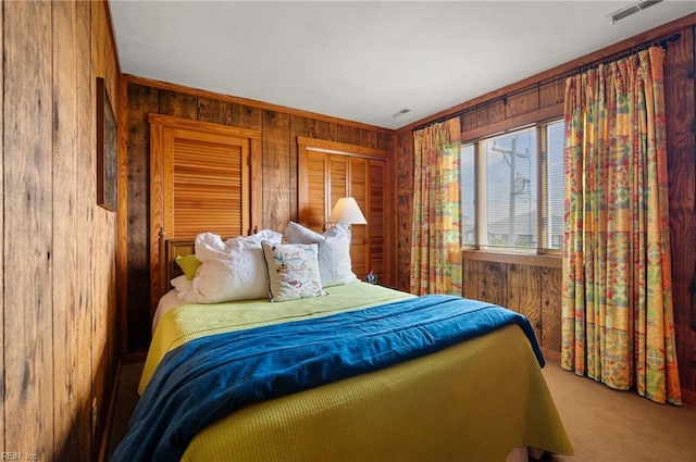 3225 Sandfiddler Rd, Virginia Beach, VA 23456 - bedroom with wood walls, carpet flooring, and crown molding