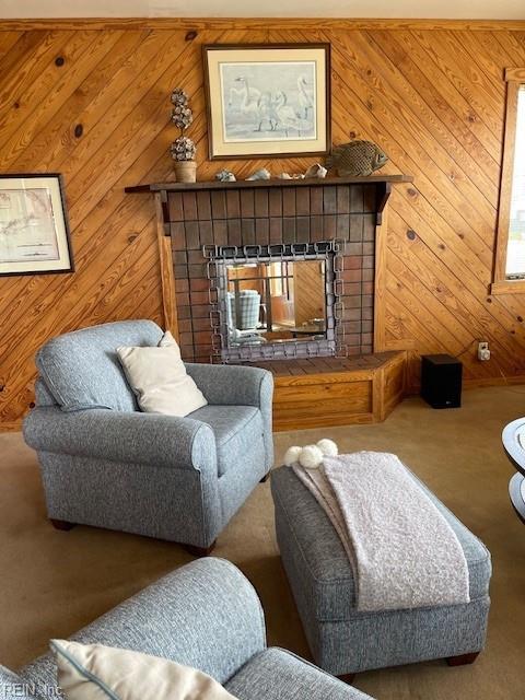 3225 Sandfiddler Rd, Virginia Beach, VA 23456 - carpeted living room with a tiled fireplace and wooden walls