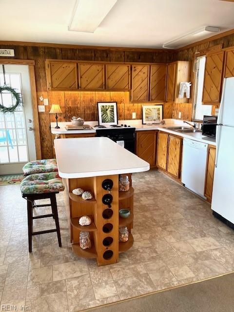 3225 Sandfiddler Rd, Virginia Beach, VA 23456 - kitchen featuring white appliances, open shelves, wood walls, light countertops, and brown cabinets