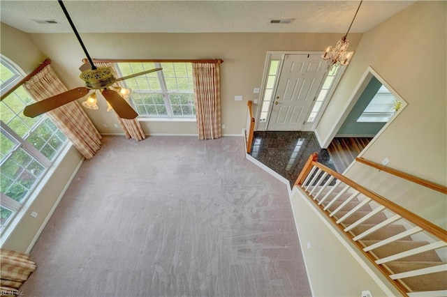 307 Melrose Ct, Suffolk, VA 23434 - carpeted foyer featuring a chandelier, stairway, and ceiling fan