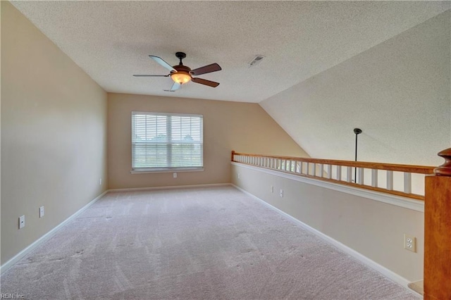 307 Melrose Ct, Suffolk, VA 23434 - spare room with ceiling fan, carpet floors, a textured ceiling, and vaulted ceiling