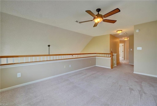 307 Melrose Ct, Suffolk, VA 23434 - spare room with a ceiling fan, light carpet, and vaulted ceiling