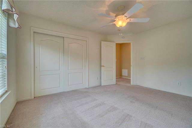 307 Melrose Ct, Suffolk, VA 23434 - unfurnished bedroom featuring carpet flooring, a closet, and a ceiling fan