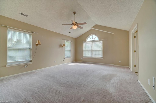 307 Melrose Ct, Suffolk, VA 23434 - carpeted empty room featuring a ceiling fan, lofted ceiling, and a textured ceiling