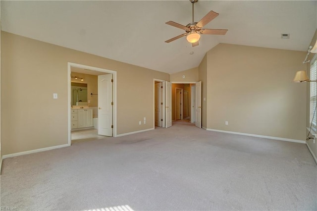 307 Melrose Ct, Suffolk, VA 23434 - unfurnished bedroom featuring light carpet, vaulted ceiling, connected bathroom, and a ceiling fan