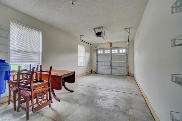 307 Melrose Ct, Suffolk, VA 23434 - garage featuring a garage door opener and baseboards