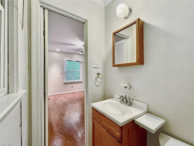 4 Everett Dr, Newport News, VA 23602 - half bathroom with vanity, wood finished floors, and a ceiling fan