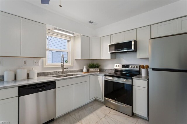 922 Old Virginia Beach Rd, Virginia Beach, VA 23451 - kitchen featuring appliances with stainless steel finishes and white cabinetry