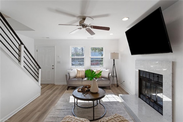 922 Old Virginia Beach Rd, Virginia Beach, VA 23451 - living room featuring stairway, light wood-type flooring, ceiling fan, a high end fireplace, and recessed lighting