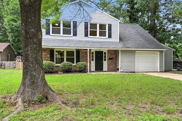 1027 E Little Back River Rd, Hampton, VA 23669 - traditional-style house featuring a garage, brick siding, and concrete driveway