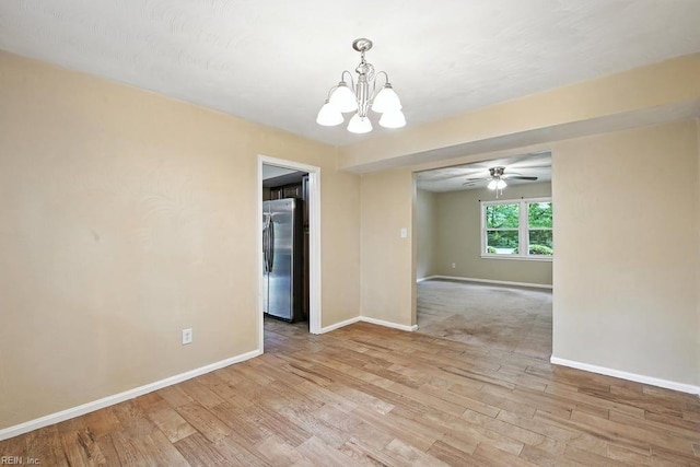 1027 E Little Back River Rd, Hampton, VA 23669 - empty room with a chandelier, wood finished floors, and a ceiling fan