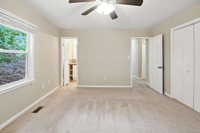 1027 E Little Back River Rd, Hampton, VA 23669 - unfurnished bedroom with carpet flooring, a ceiling fan, connected bathroom, and a closet