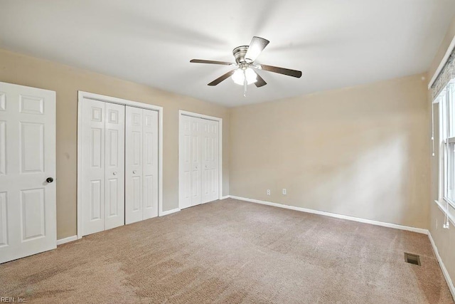 1027 E Little Back River Rd, Hampton, VA 23669 - unfurnished bedroom featuring carpet, two closets, and ceiling fan