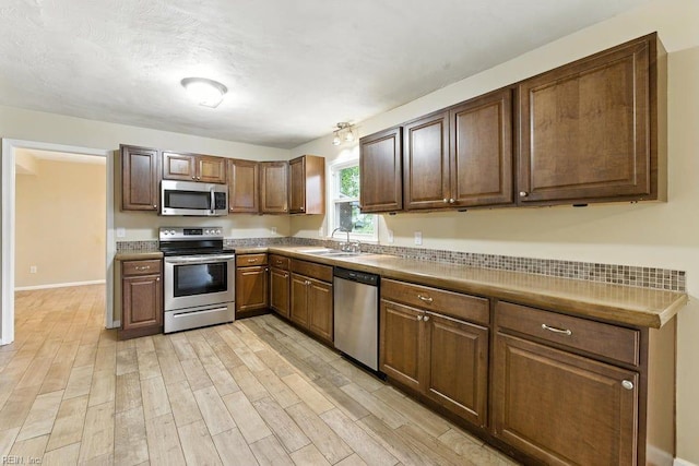 1027 E Little Back River Rd, Hampton, VA 23669 - kitchen featuring stainless steel appliances and light wood finished floors