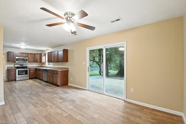 1027 E Little Back River Rd, Hampton, VA 23669 - kitchen featuring stainless steel appliances, light wood-style flooring, light countertops, and ceiling fan