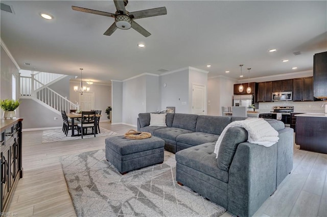 1928 Bexley Ln, Chesapeake, VA 23322 - living room featuring crown molding, a chandelier, recessed lighting, ceiling fan, and light wood-style floors