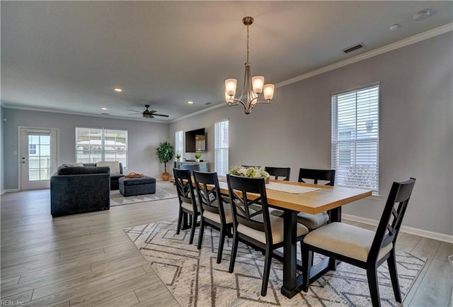 1928 Bexley Ln, Chesapeake, VA 23322 - dining area featuring ornamental molding, light wood-style flooring, a chandelier, a ceiling fan, and recessed lighting