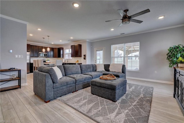 1928 Bexley Ln, Chesapeake, VA 23322 - living room with light wood-type flooring, ceiling fan, recessed lighting, and crown molding