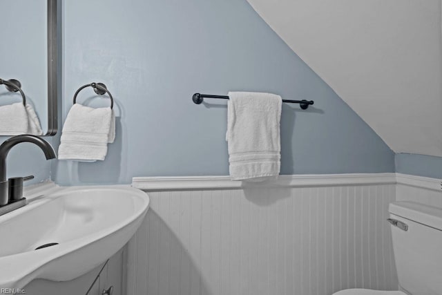 2233 Keller Ave, Norfolk, VA 23509 - half bath featuring a wainscoted wall, lofted ceiling, and vanity