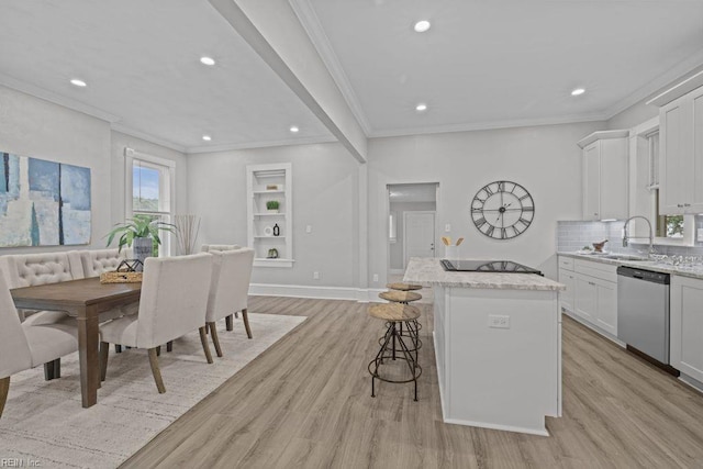 2233 Keller Ave, Norfolk, VA 23509 - kitchen featuring dishwasher, crown molding, black electric stovetop, a kitchen island, and light wood finished floors