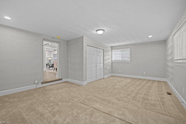 2233 Keller Ave, Norfolk, VA 23509 - unfurnished bedroom with light colored carpet, recessed lighting, and a closet