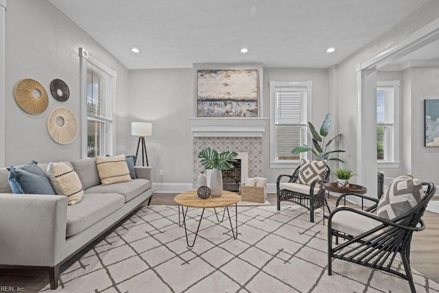 2233 Keller Ave, Norfolk, VA 23509 - living area with wood finished floors, a tile fireplace, and recessed lighting