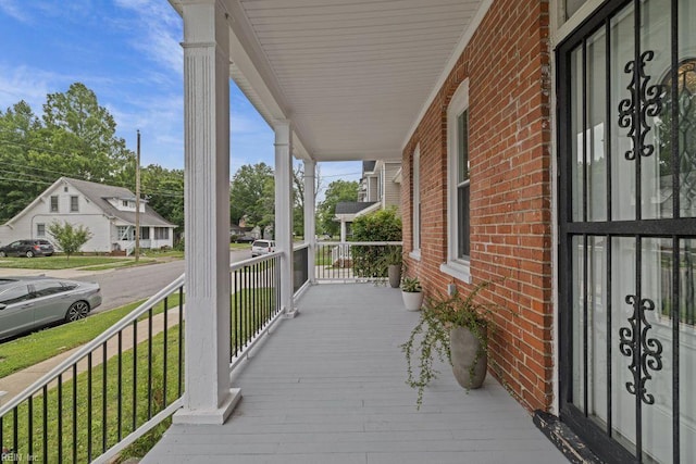 2233 Keller Ave, Norfolk, VA 23509 - wooden porch featuring a residential view