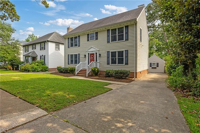 929 Magnolia Ave, Norfolk, VA 23508 - colonial-style house with a front lawn