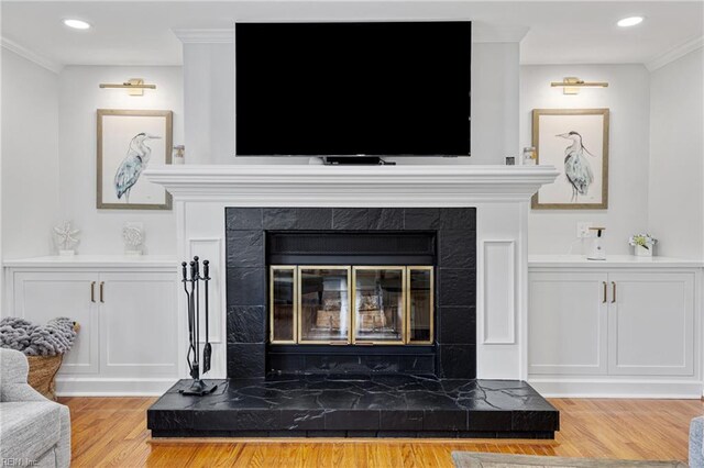 929 Magnolia Ave, Norfolk, VA 23508 - detailed view of a tile fireplace, wood finished floors, ornamental molding, and recessed lighting