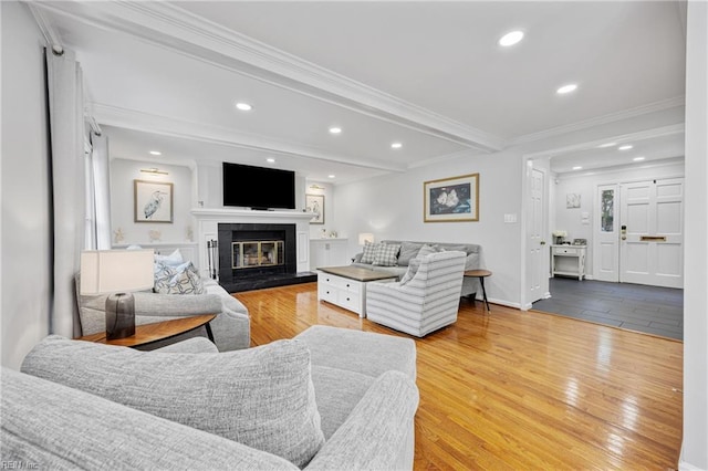 929 Magnolia Ave, Norfolk, VA 23508 - living area featuring ornamental molding, a glass covered fireplace, recessed lighting, wood finished floors, and beam ceiling