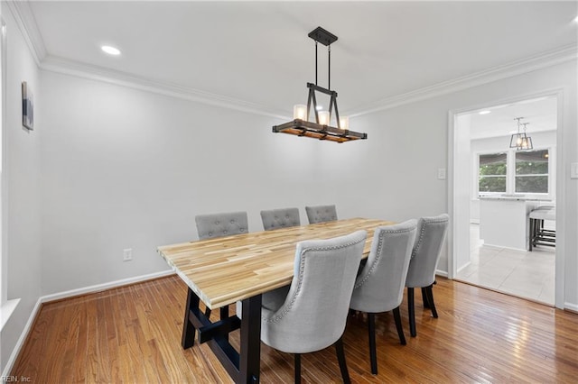 929 Magnolia Ave, Norfolk, VA 23508 - dining space with crown molding, wood finished floors, and recessed lighting