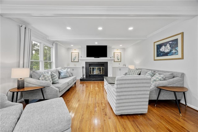 929 Magnolia Ave, Norfolk, VA 23508 - living area with light wood finished floors, a glass covered fireplace, beam ceiling, ornamental molding, and recessed lighting